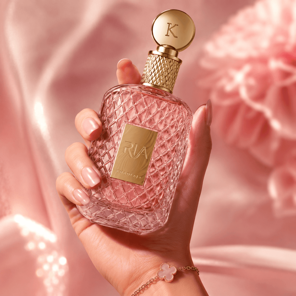 Khadlaj Ria women's perfume in a vibrant red berry fragrance setting