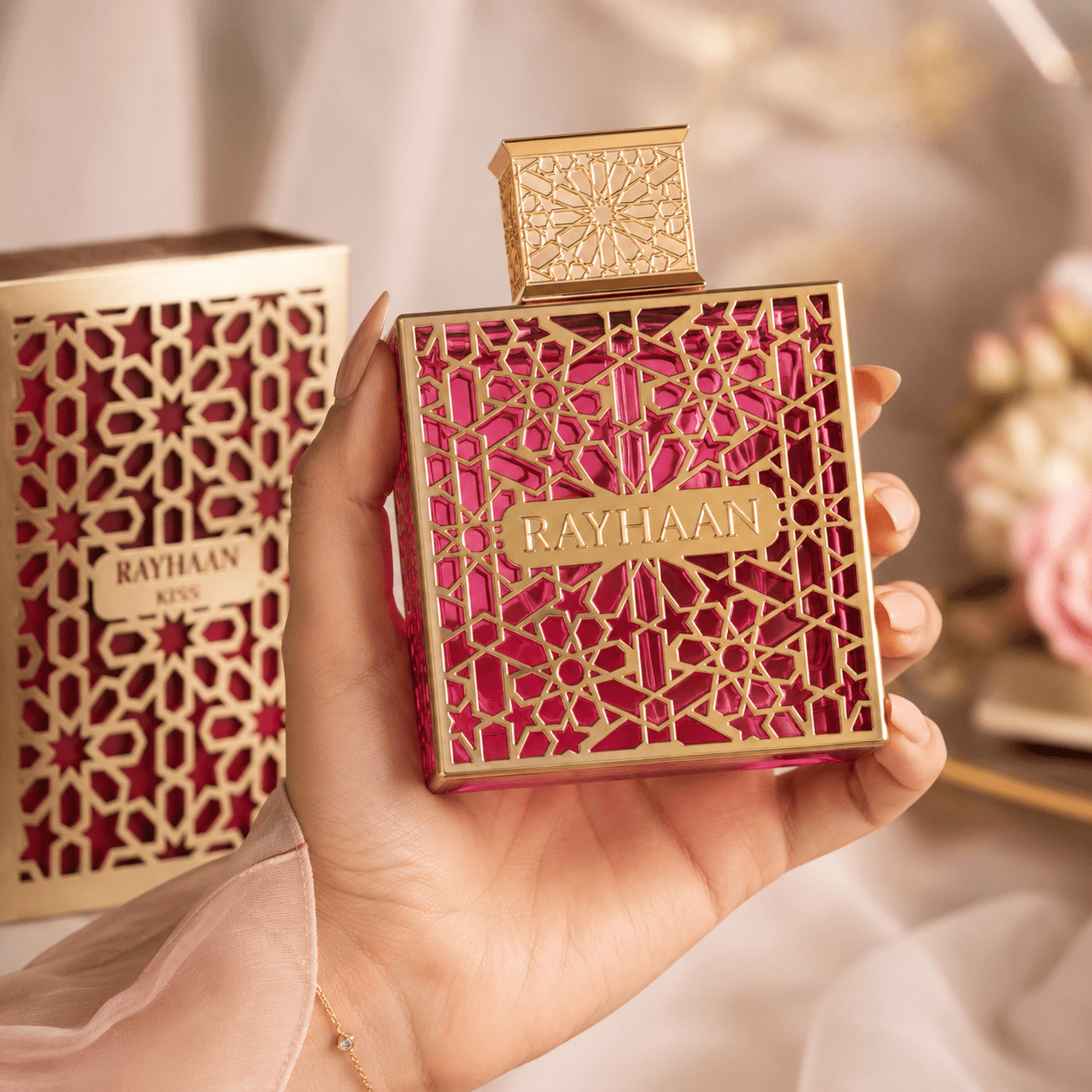 Rayhaan Kiss women's perfume bottle in an elegant feminine fragrance setting