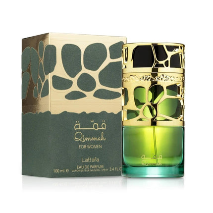 Green perfume bottle with gold cap next to its packaging on a white background