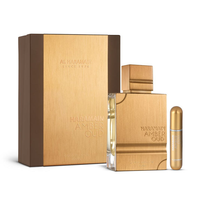 Al Haramain Amber Oud perfume set with gold packaging on a white background