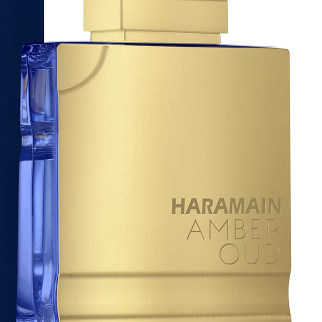 Haramain Ambee Oud Bleu Edition perfume bottle with gold and blue design.
