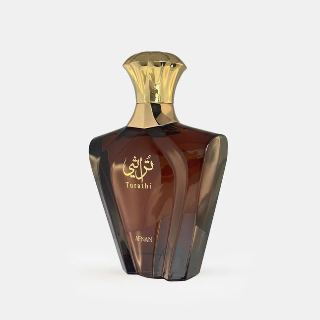 Brown perfume bottle with gold cap on a white background