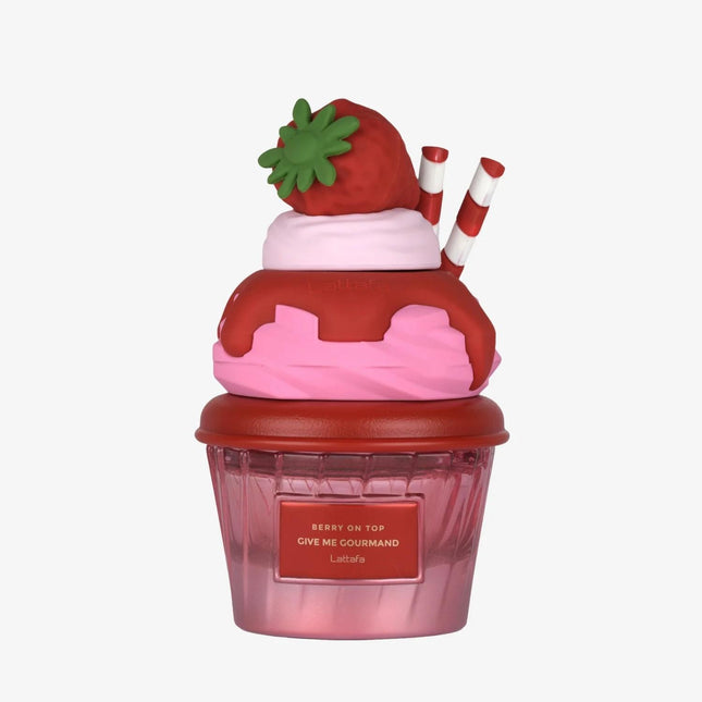 Strawberry-themed cupcake container with a lid on a white background