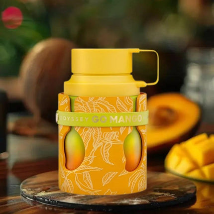 Yellow thermos with 'Odyssey Go Mango' branding on a wooden surface with mangoes in the background.