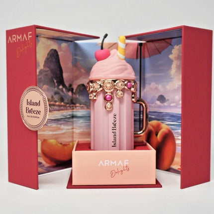 Pink perfume bottle with decorative elements in a red Armaf box
