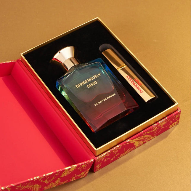 Two perfume bottles in a decorative box on a beige background