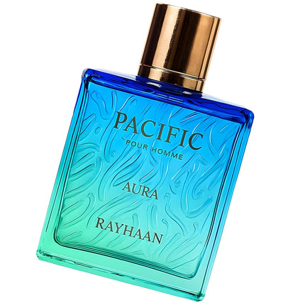 Blue perfume bottle with gold cap labeled 'Pacific Aura Rayhaan' on a white background