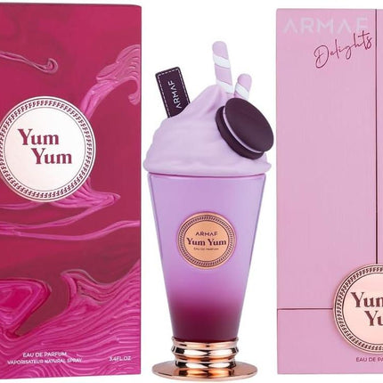 Pink 'Yum Yum' perfume bottle with matching packaging on a white background