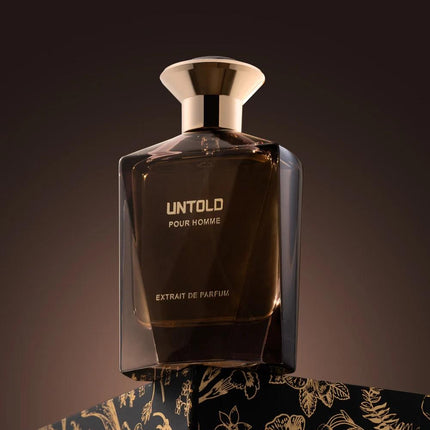 Perfume bottle labeled 'Untold Pour Homme' on a dark background