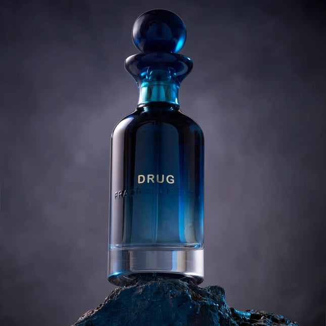 Blue glass bottle labeled 'Drug' on a dark background