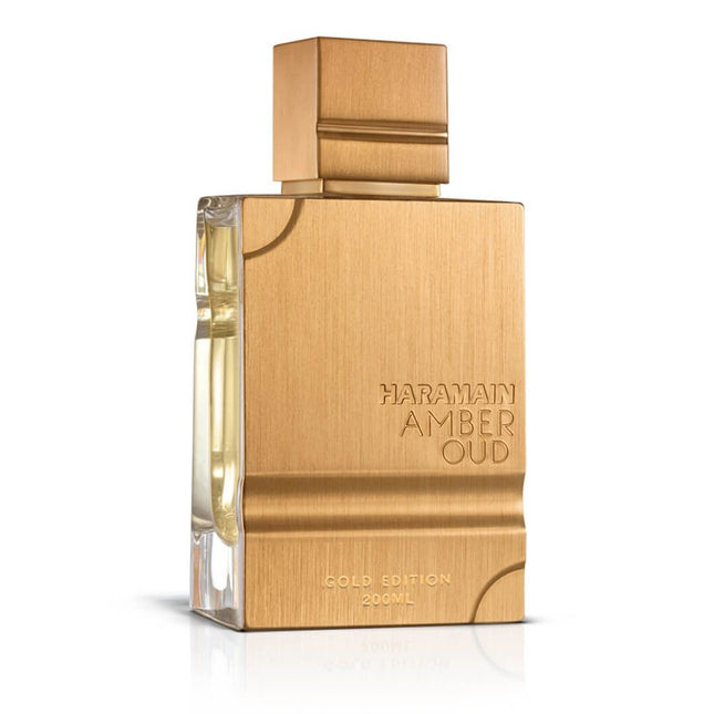 Gold perfume bottle with 'Haramain Amber Oud' text on a white background